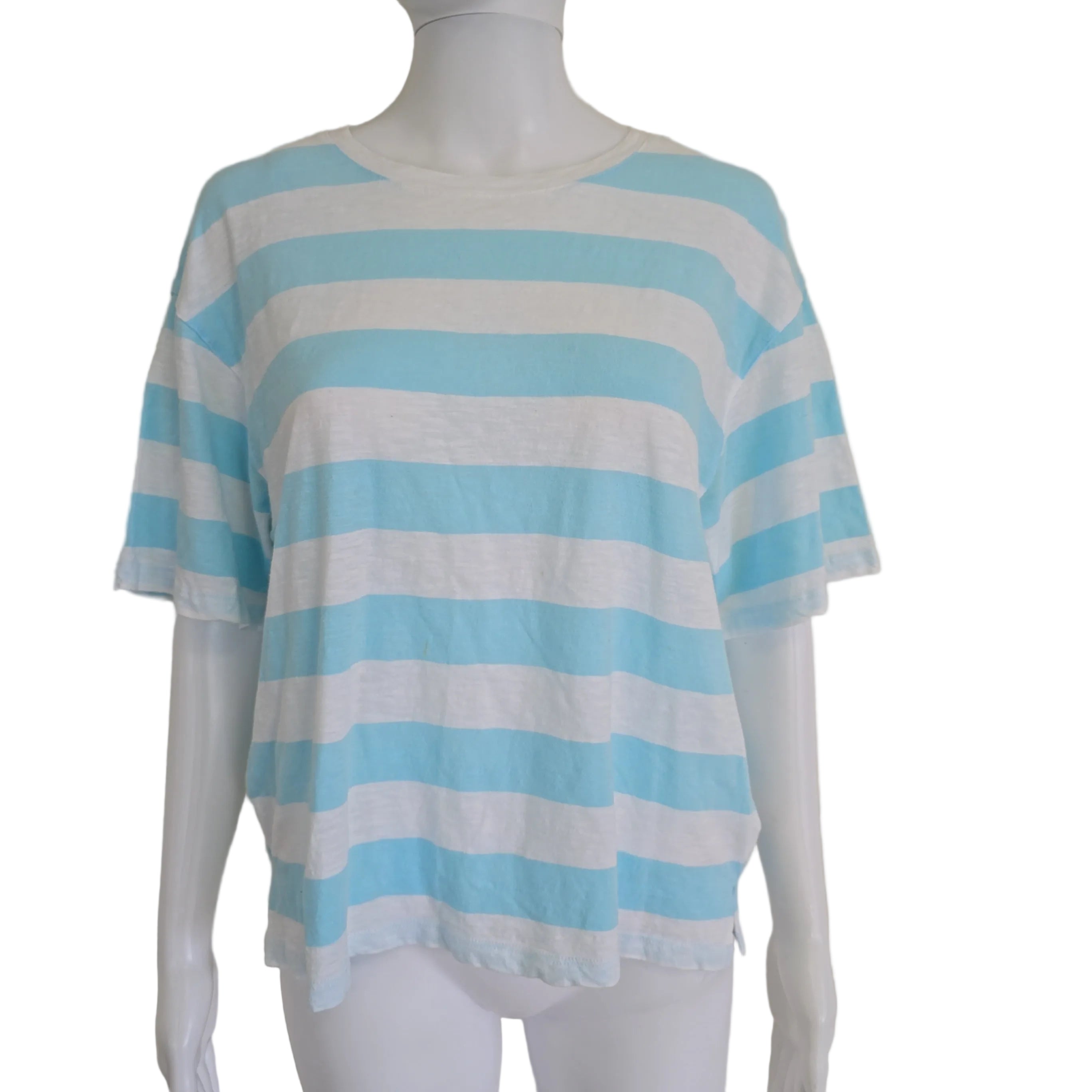 Mannequin wearing a light blue and white striped garment on a beige background