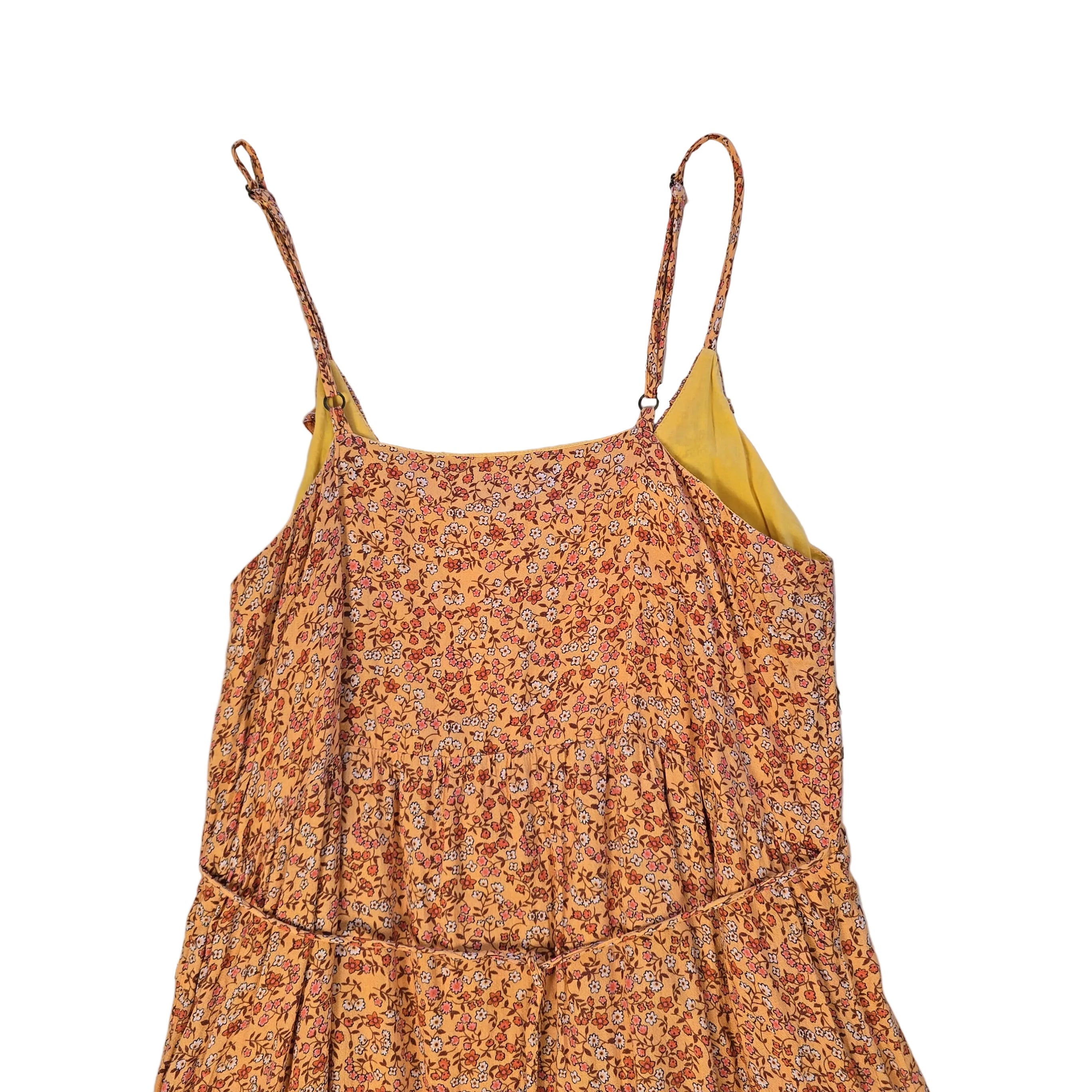 Floral dress with a yellow underlayer on a light bckground