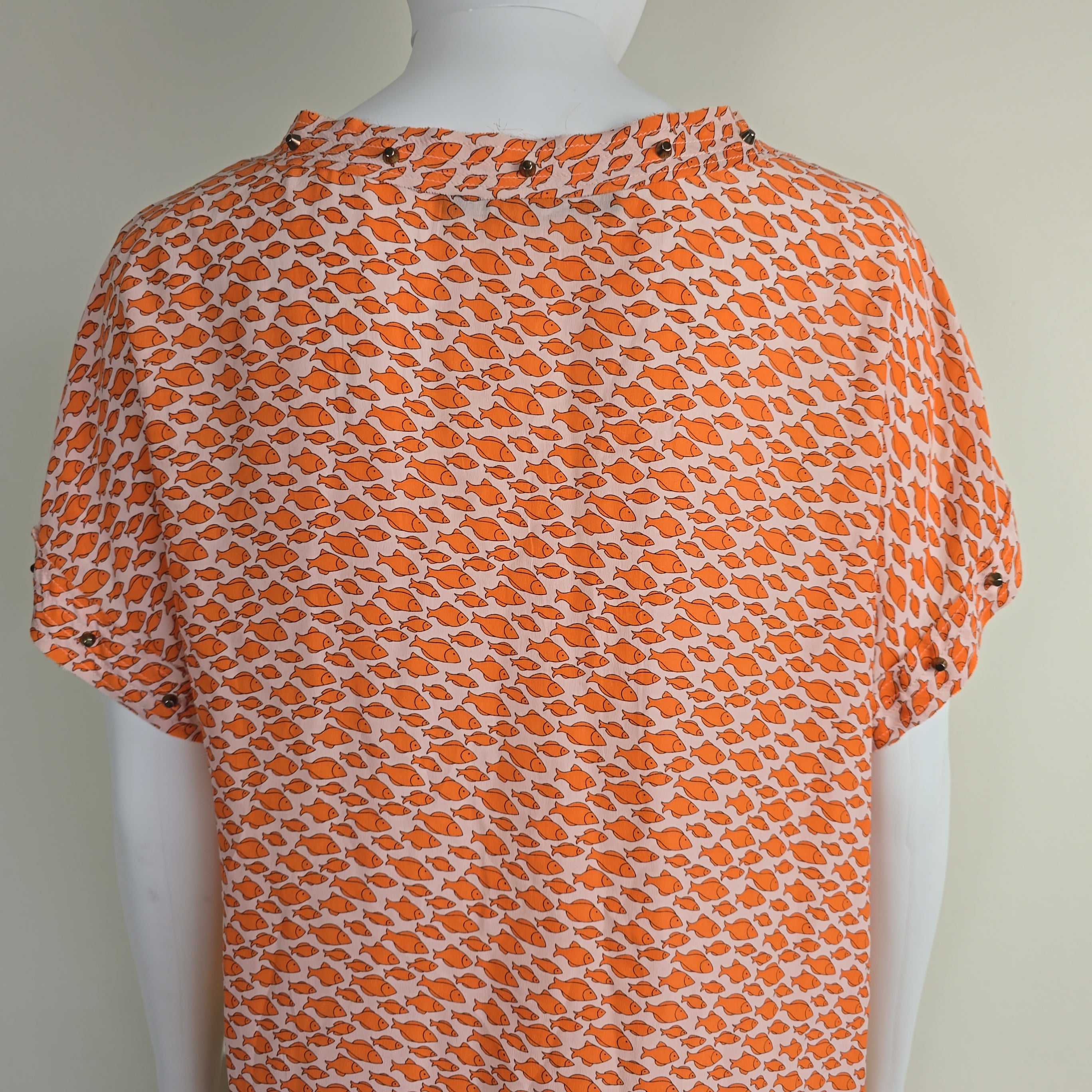 Orange patterned fabric on a white background