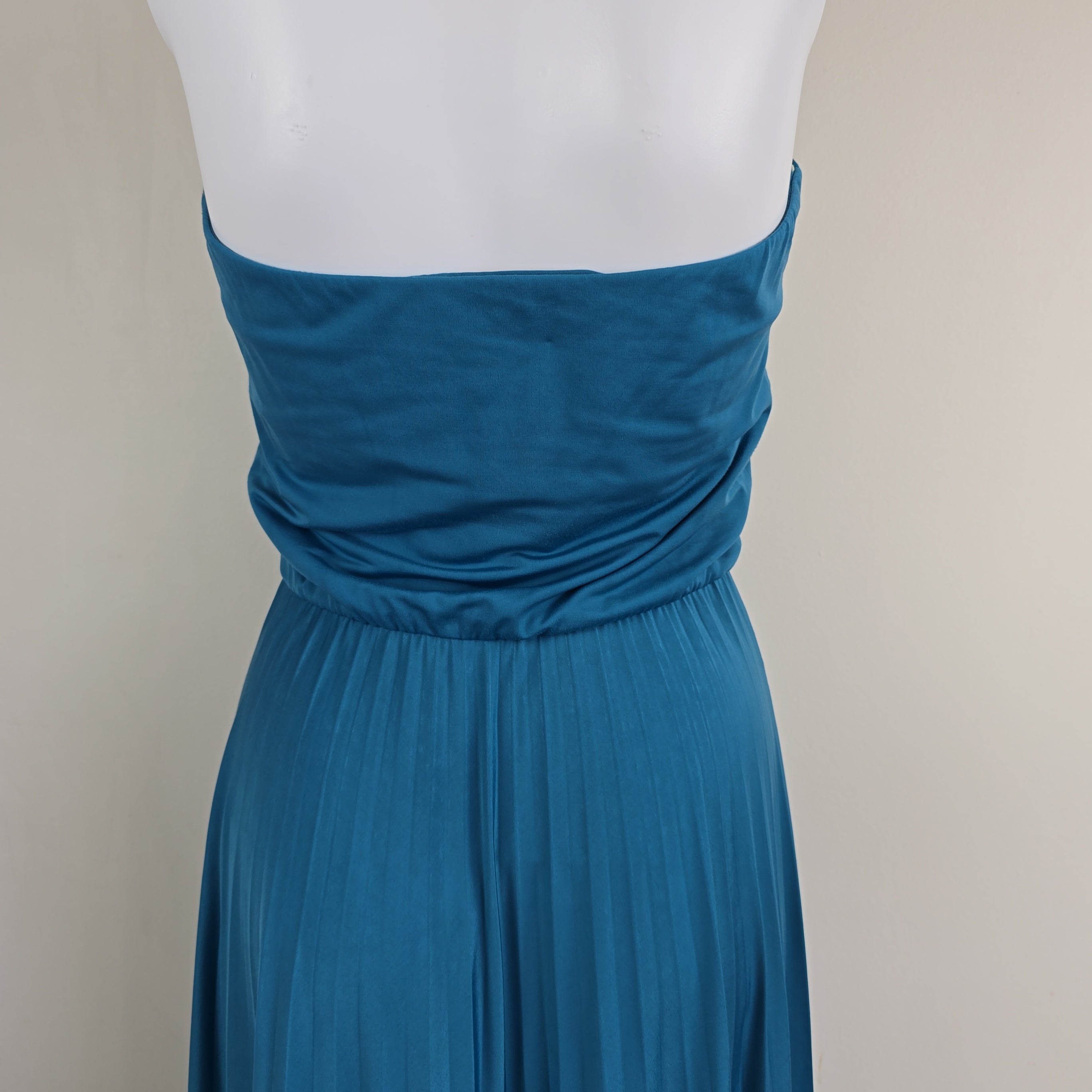Close-up of a blue dress with a white background