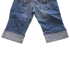 Pair of blue jean shorts on a light background