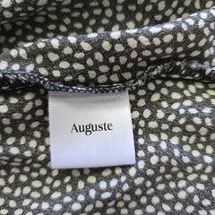 Fabric with a polka dot pattern and an 'Auguste' label.