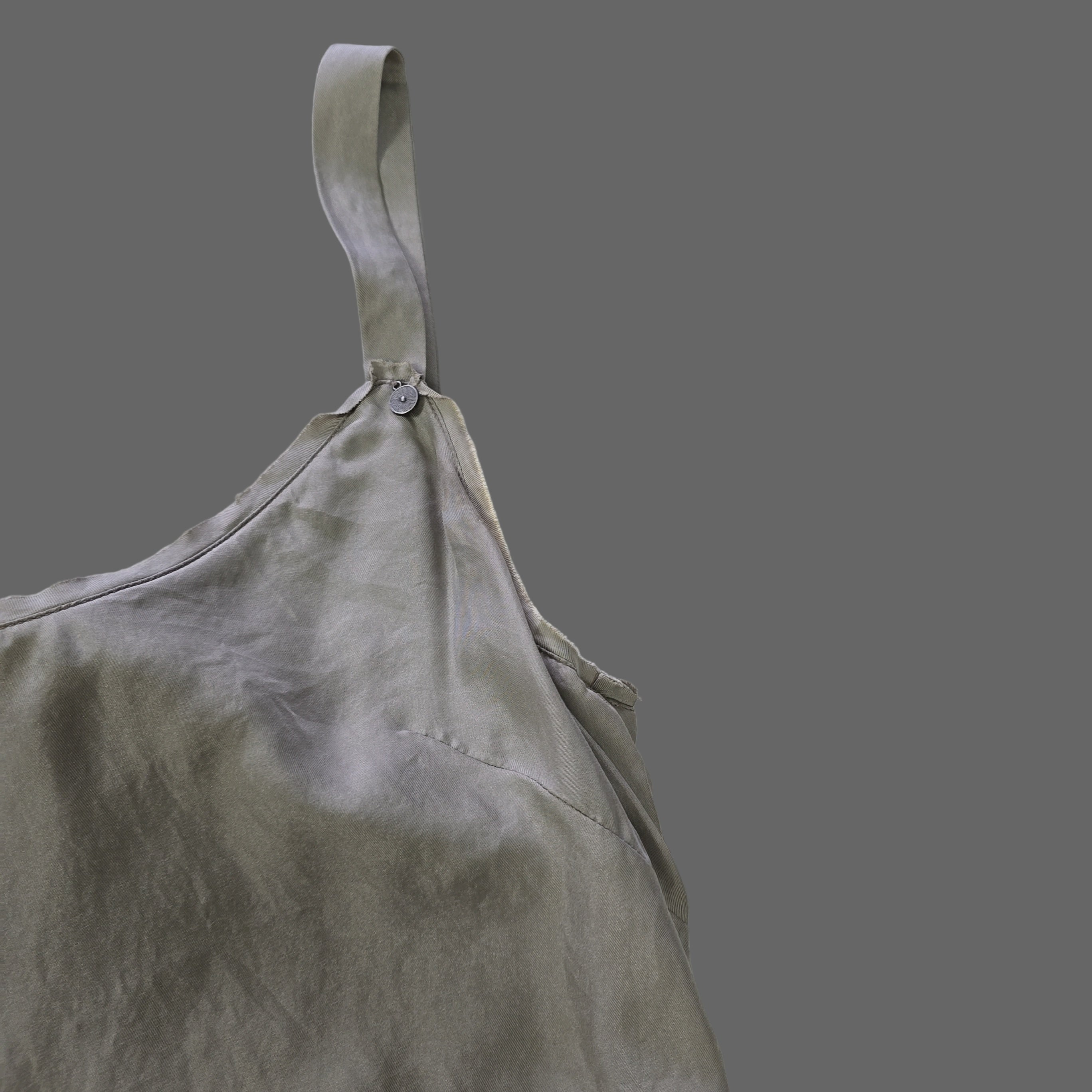 Gray top on a tiled floor