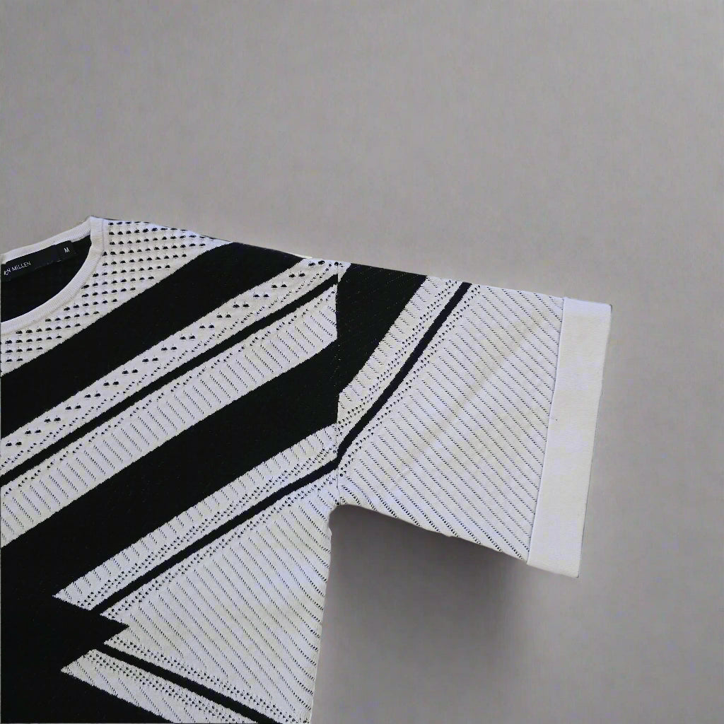 Black and white patterned Top on a tiled floor