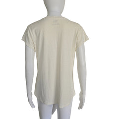 Mannequin wearing a light-colored top on a plain background