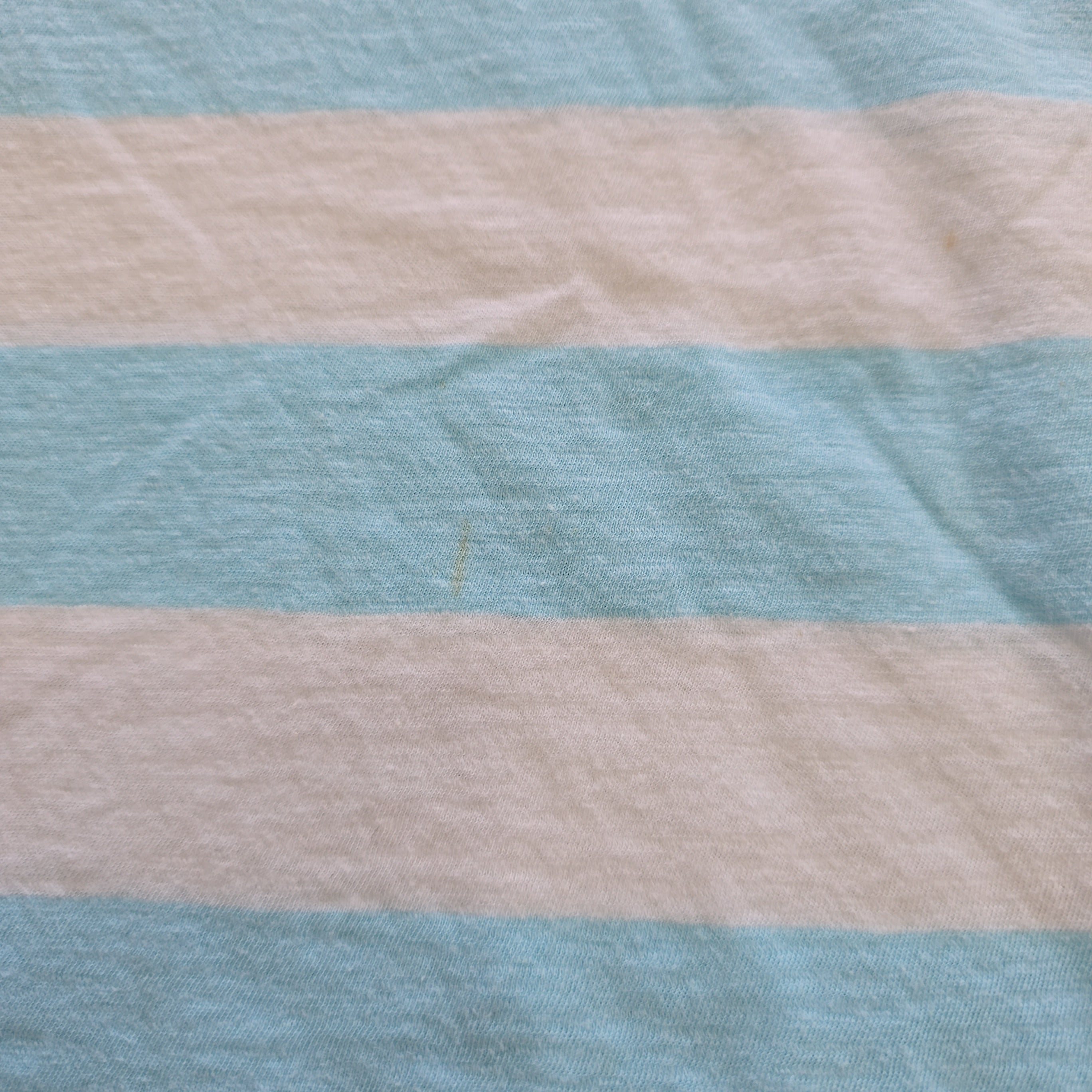 Striped fabric with alternating light blue and beige stripes