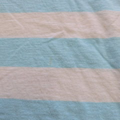 Striped fabric with alternating light blue and beige stripes