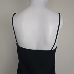 Black mini dress on a light background