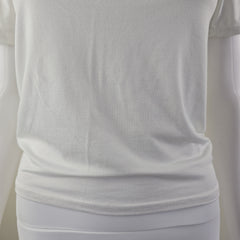 Close-up of a white fabric with folds on a light gray background