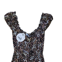 Leopard print dress on a light background