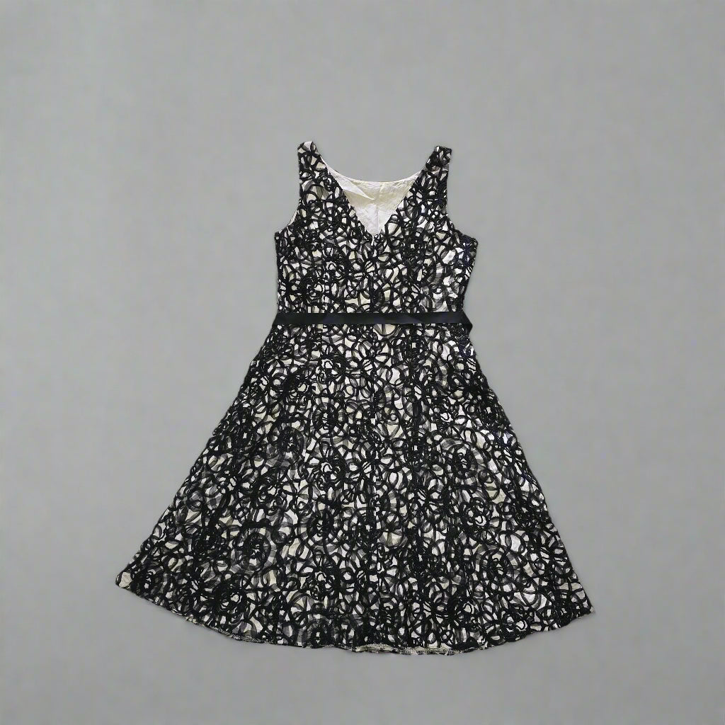 Black lace dress on a tiled floor