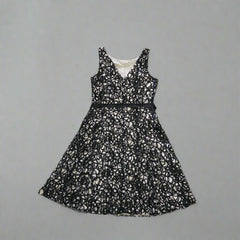 Black lace dress on a tiled floor
