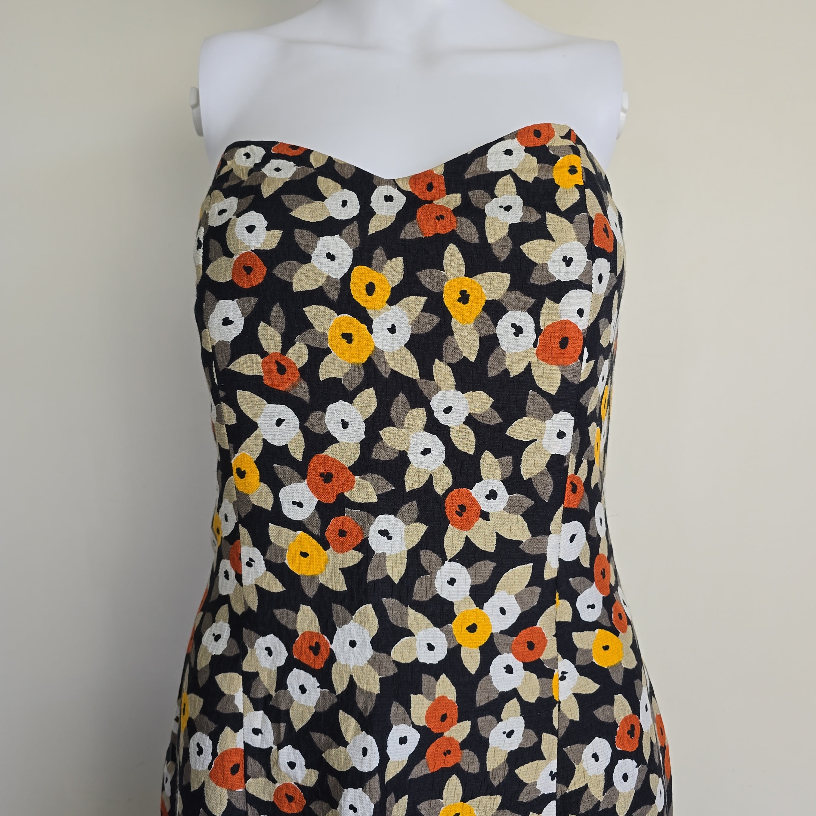 Floral-patterned strapless dress on a light background