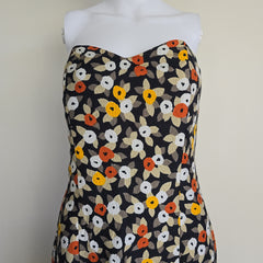 Floral-patterned strapless dress on a light background