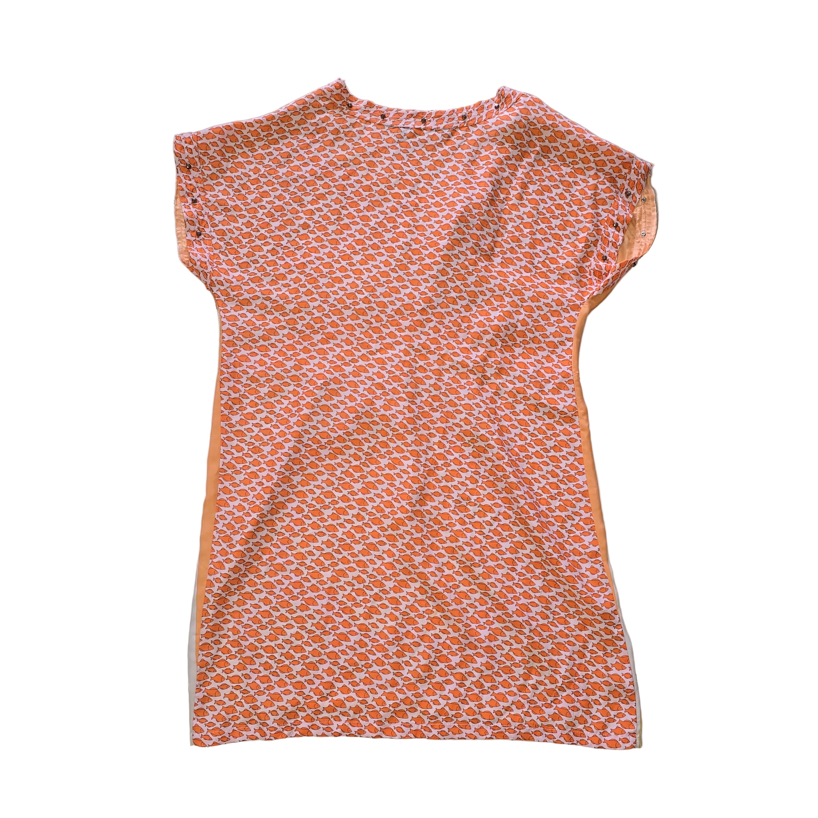 Decorative pink and yellow patterned fabric kaftan on a light background.