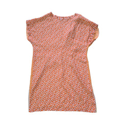 Decorative pink and yellow patterned fabric kaftan on a light background.