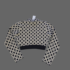 Black and white patterned fabric on a tiled floor