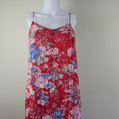 Red floral dress on a mannequin against a plain background