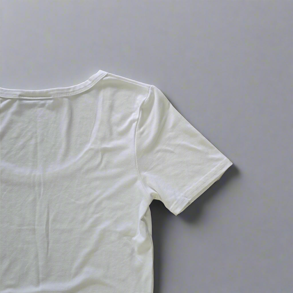 White t-shirt on a tiled floor