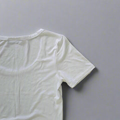 White t-shirt on a tiled floor