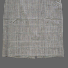 Plaid skirt on a tiled floor