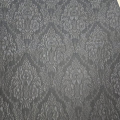 Close-up of gray lace fabric with intricate patterns