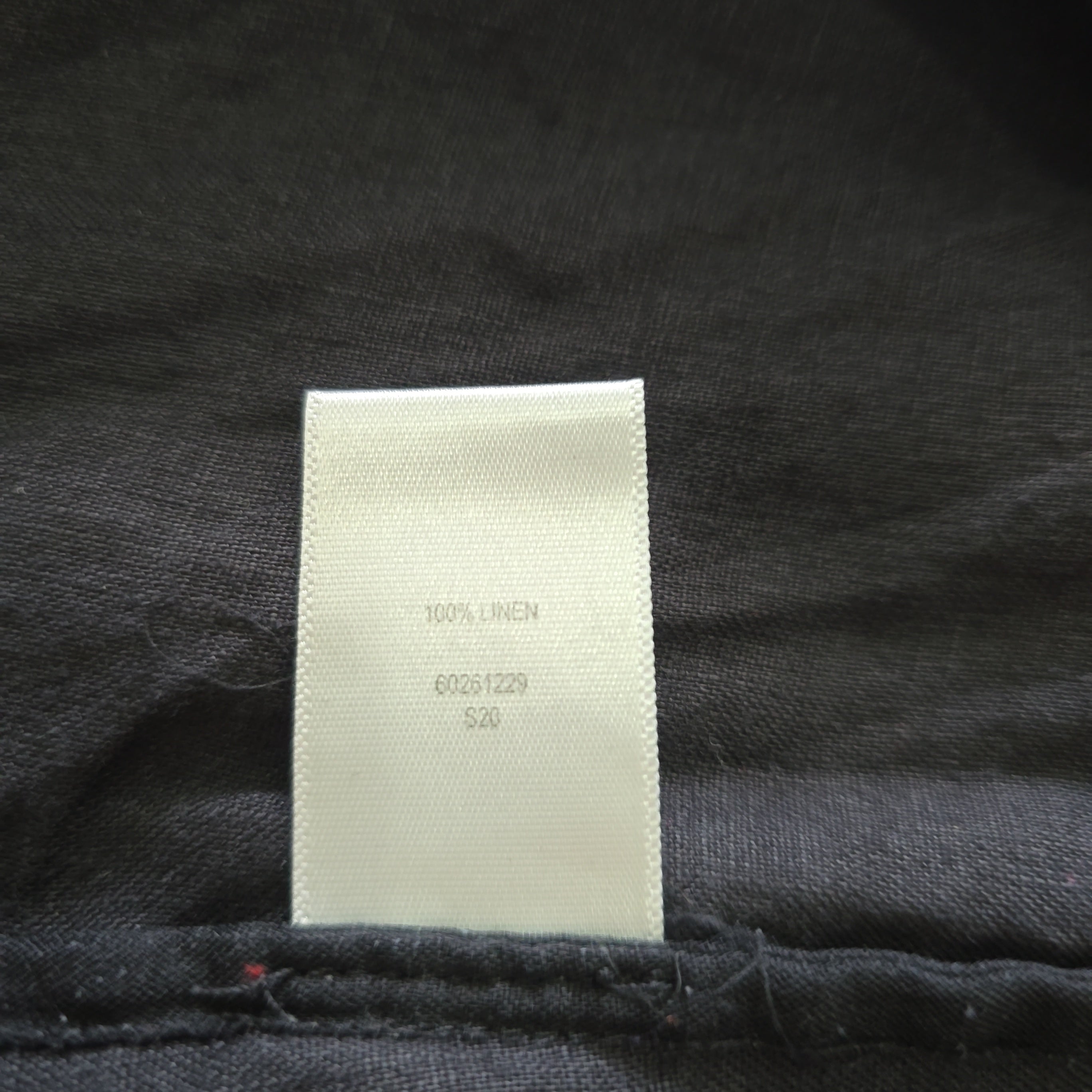 Label on a dark fabric background