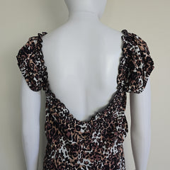Leopard print dress on a light background