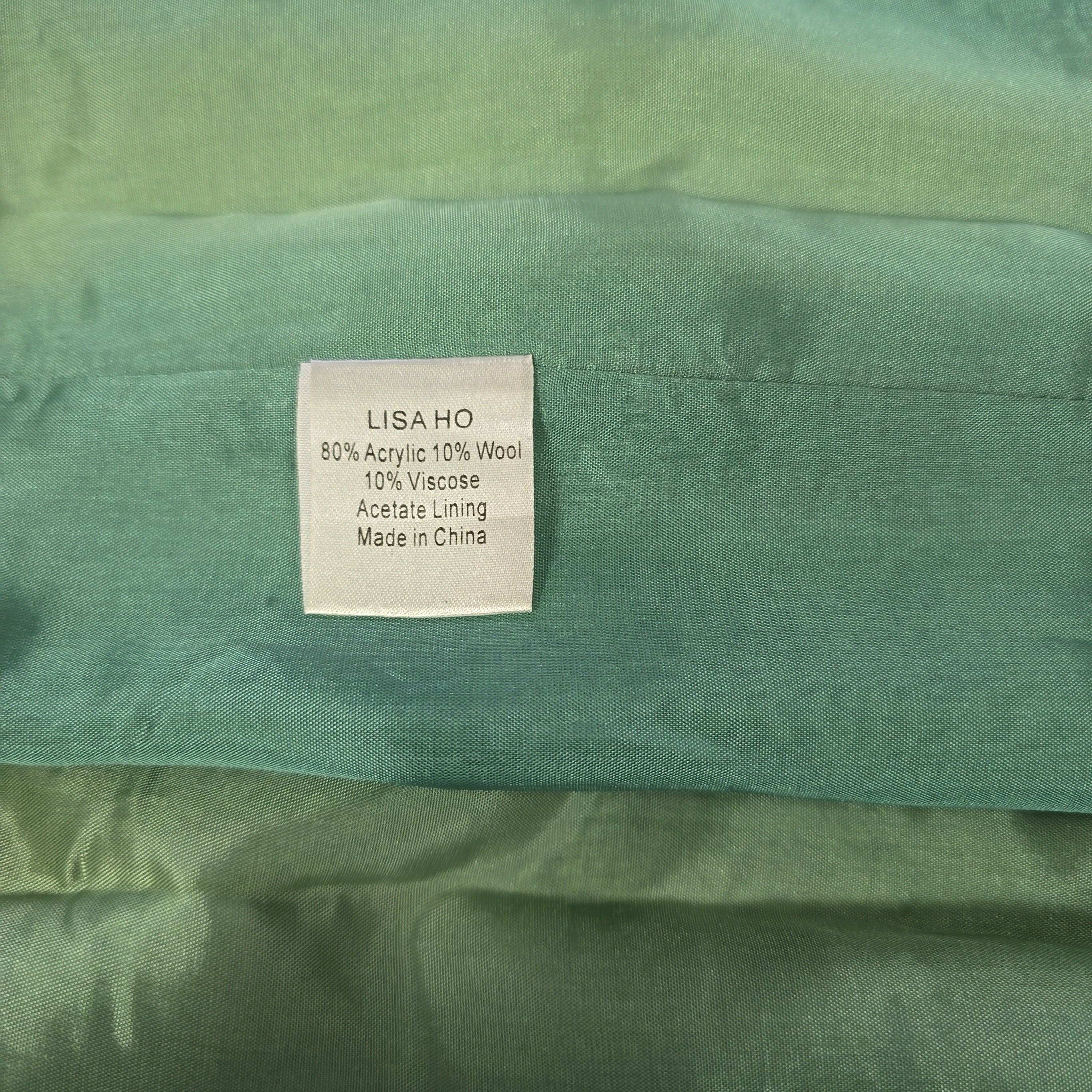 Green fabric with a label on a green background