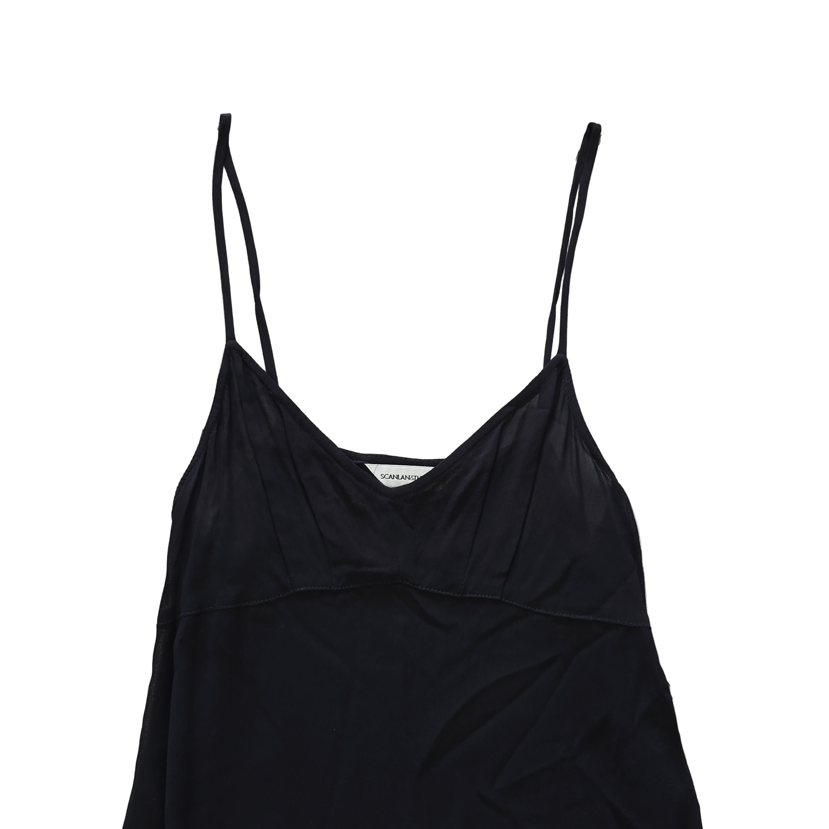 Black dress with beige lining on a light floor