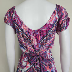 Pink and purple patterned dress on a light background