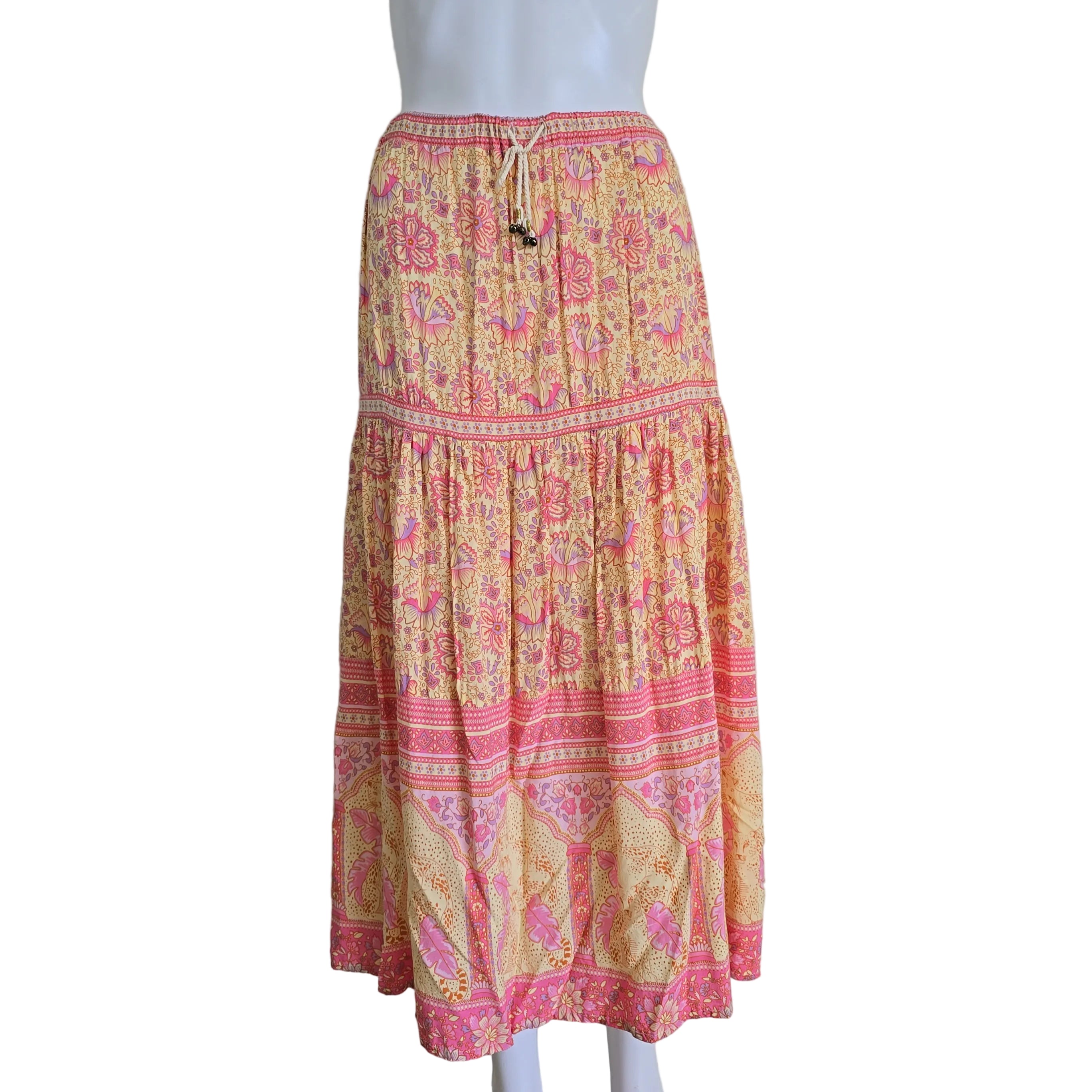 Pink and yellow patterned fabric on a white background