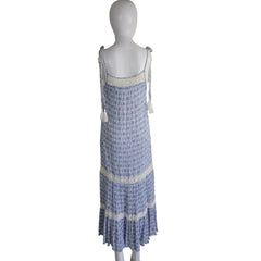 Blue and white patterned dress on a light background