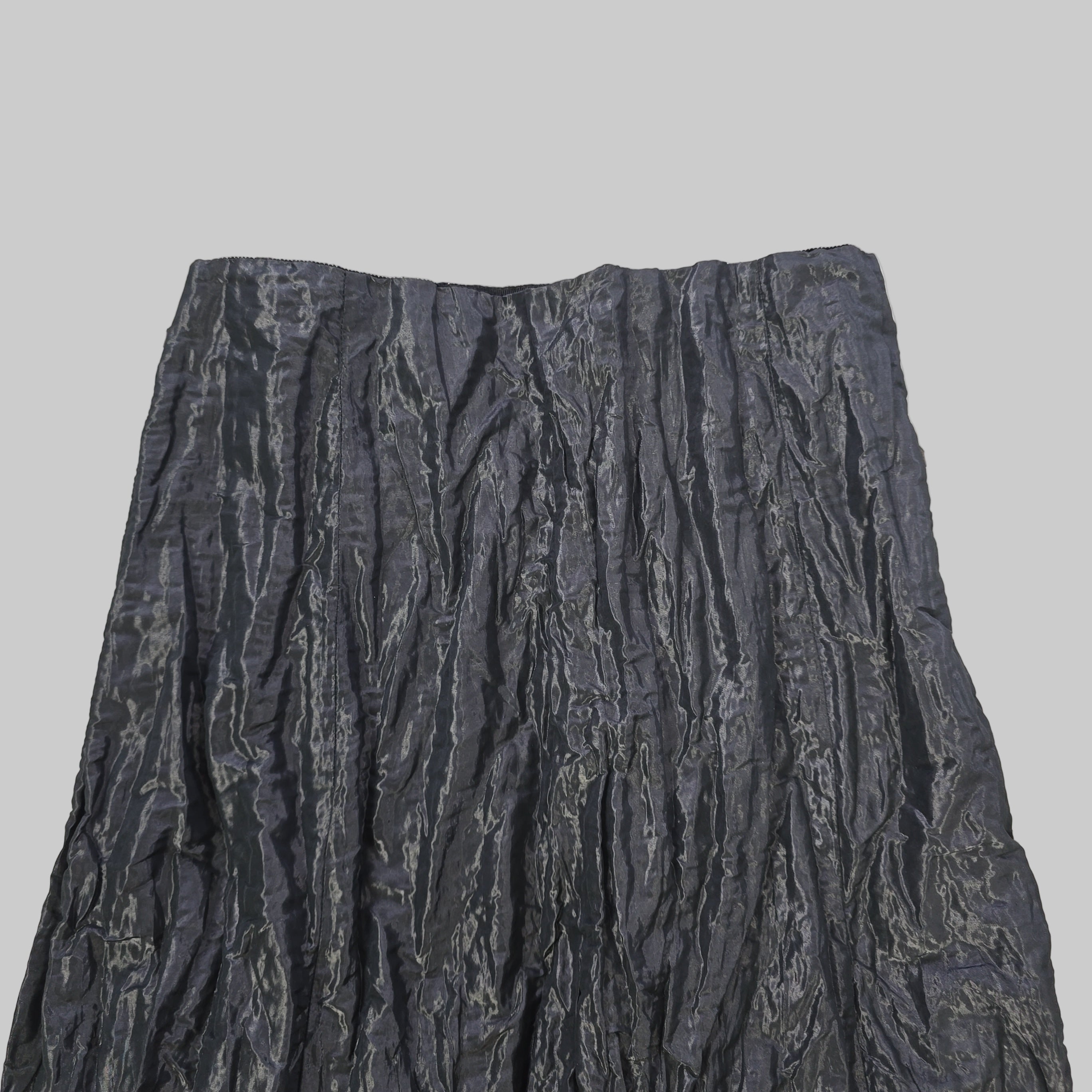 Black textured fabric on a tiled floor