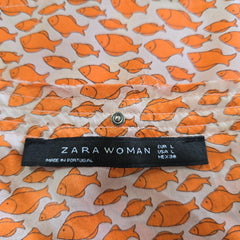 Zara Woman label on a fabric with orange fish pattern