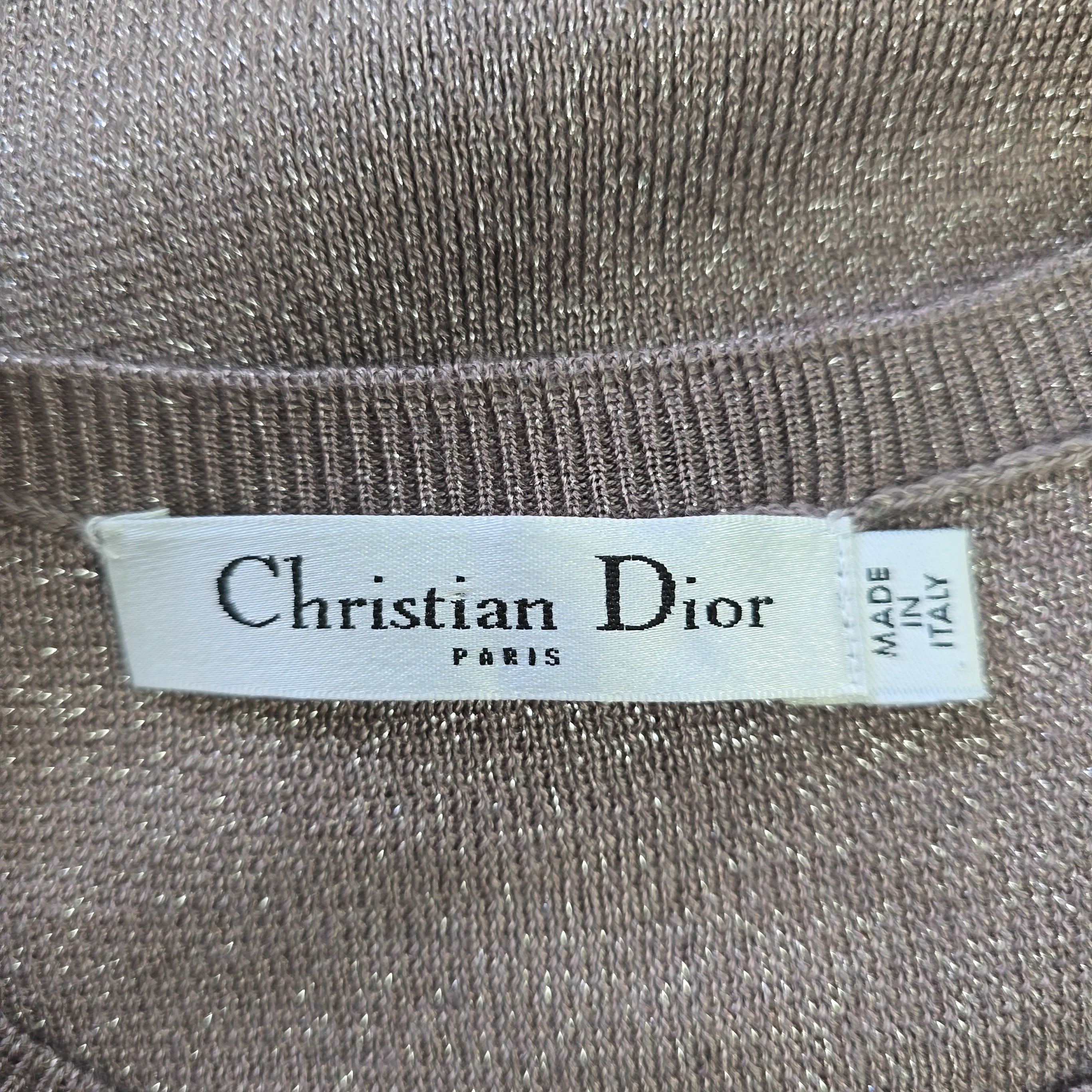 Christian Dior label on a textured fabric background