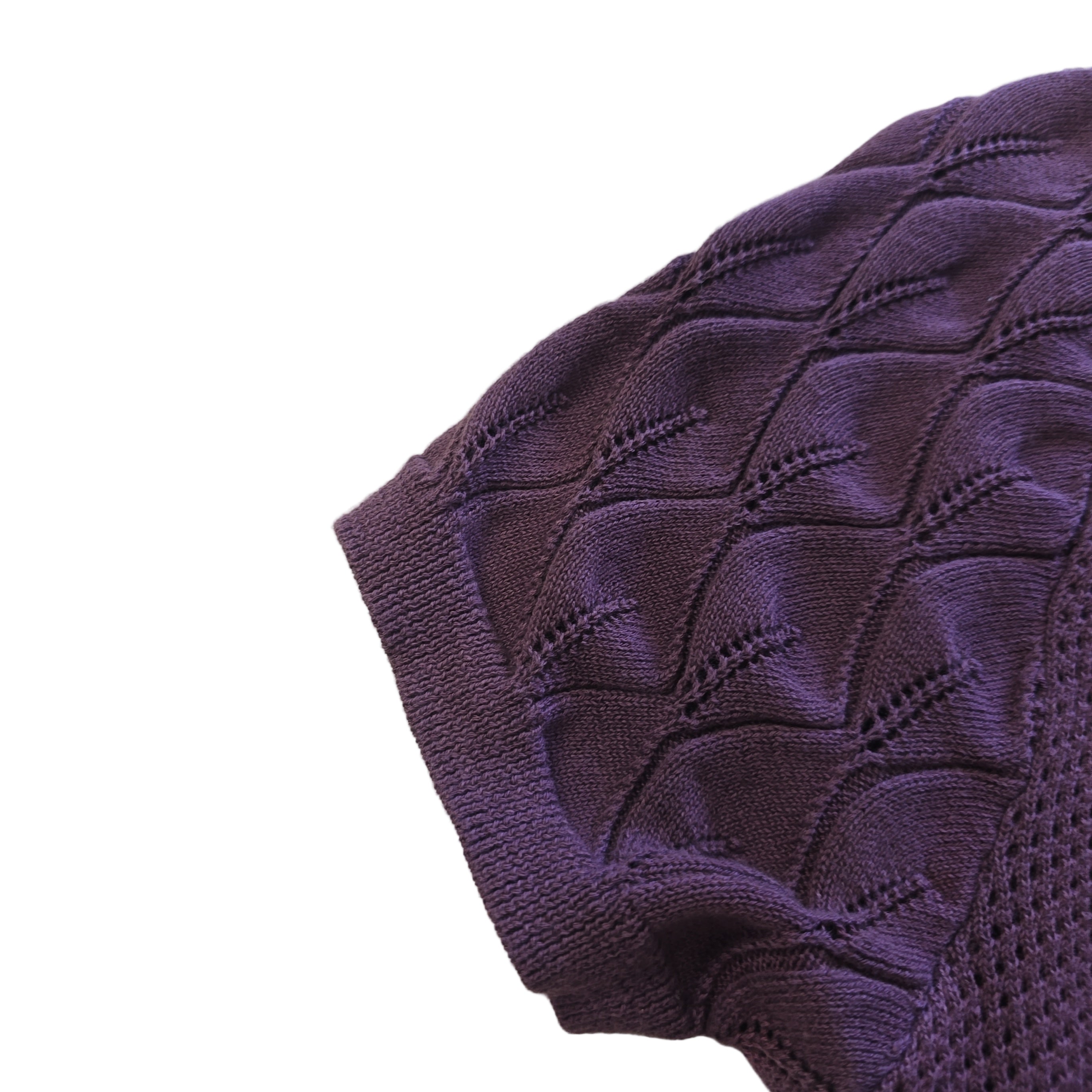Close-up of a purple textured fabric on a light background
