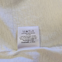 Close-up of a label on a textured fabric background