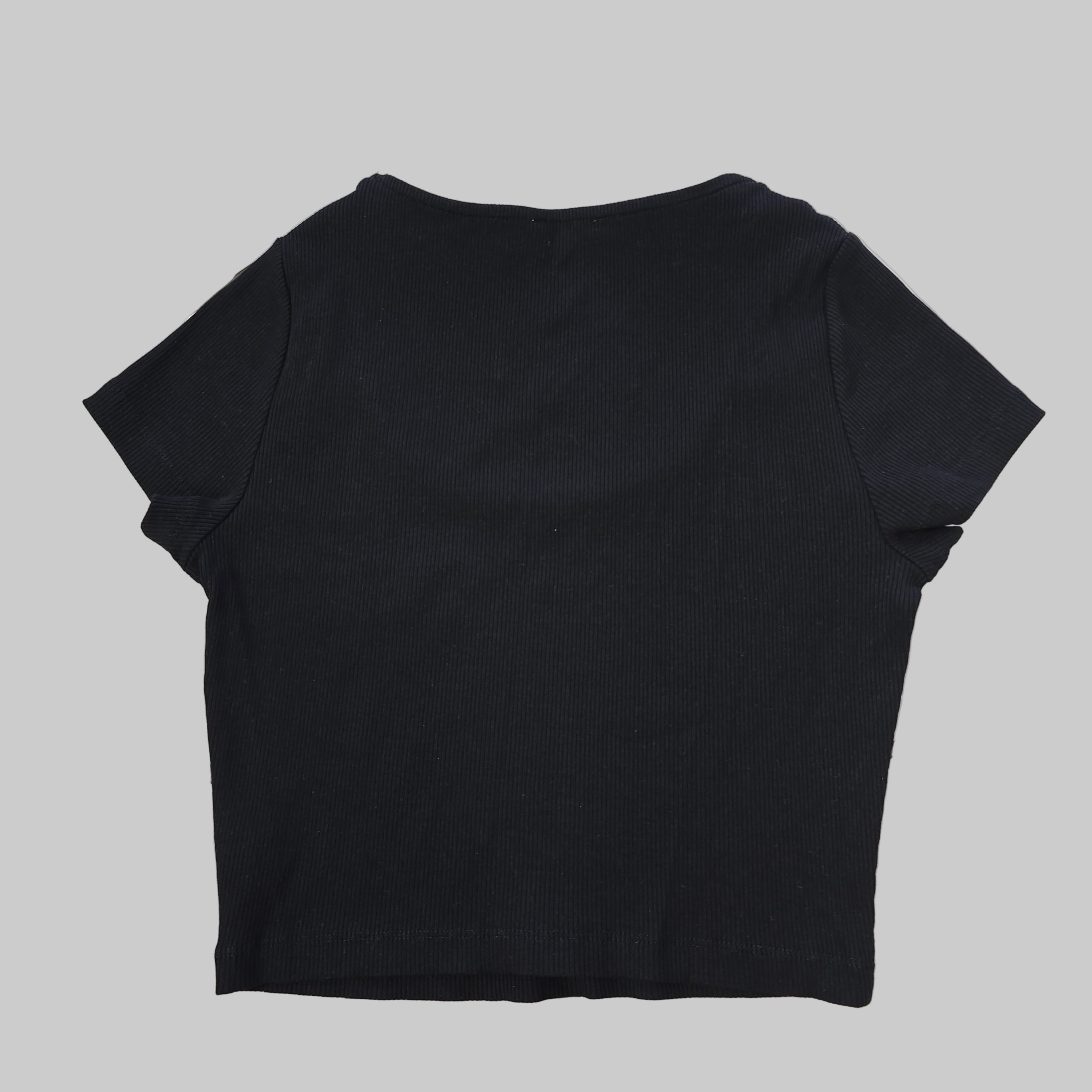 Black top on a tiled floor