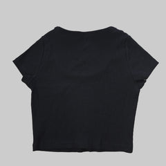 Black top on a tiled floor