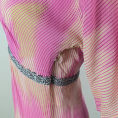 Close-up of a pink and yellow striped fabric with a textured edge.