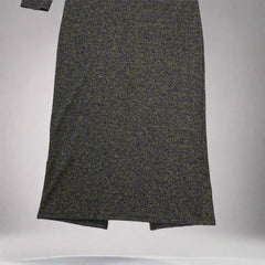 Black and gold textured dress against a light gray background