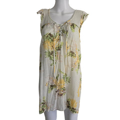 Floral dress on a mannequin against a plain background