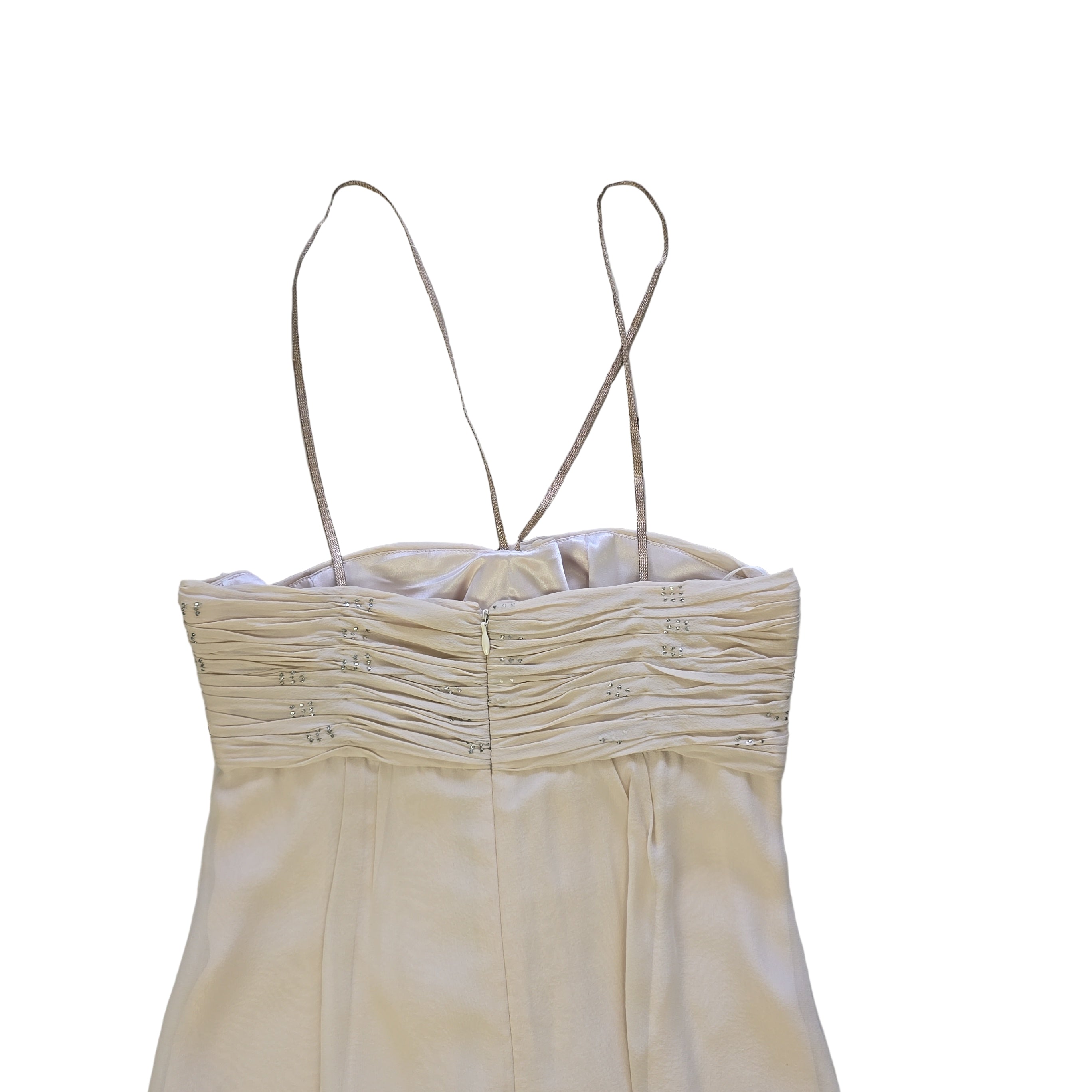 Beige dress with thin straps on a tiled floor