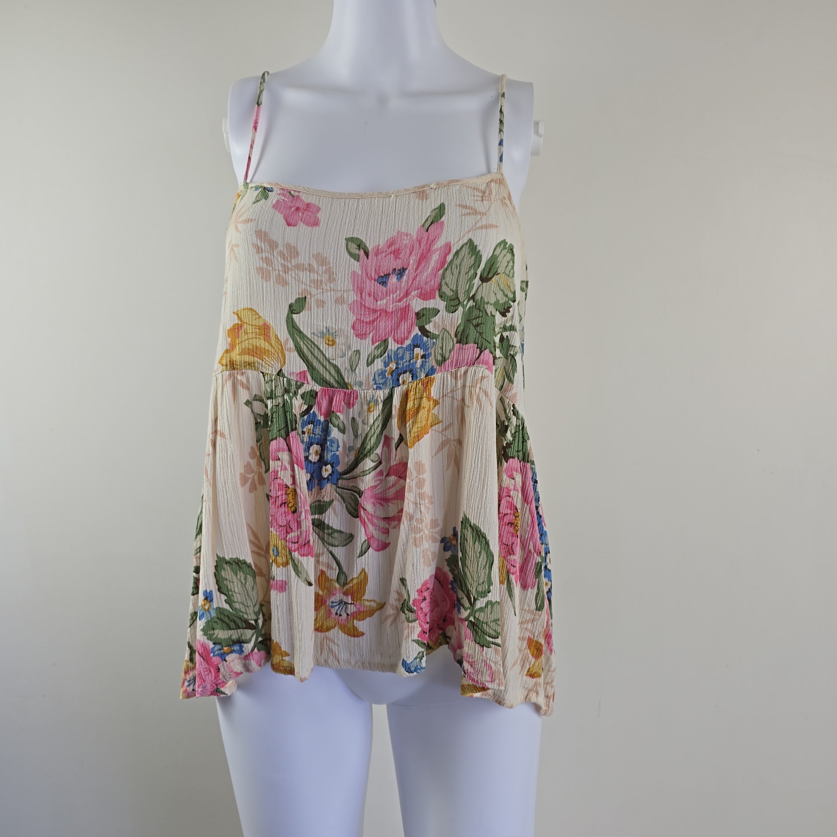 Cream floral top on a light background