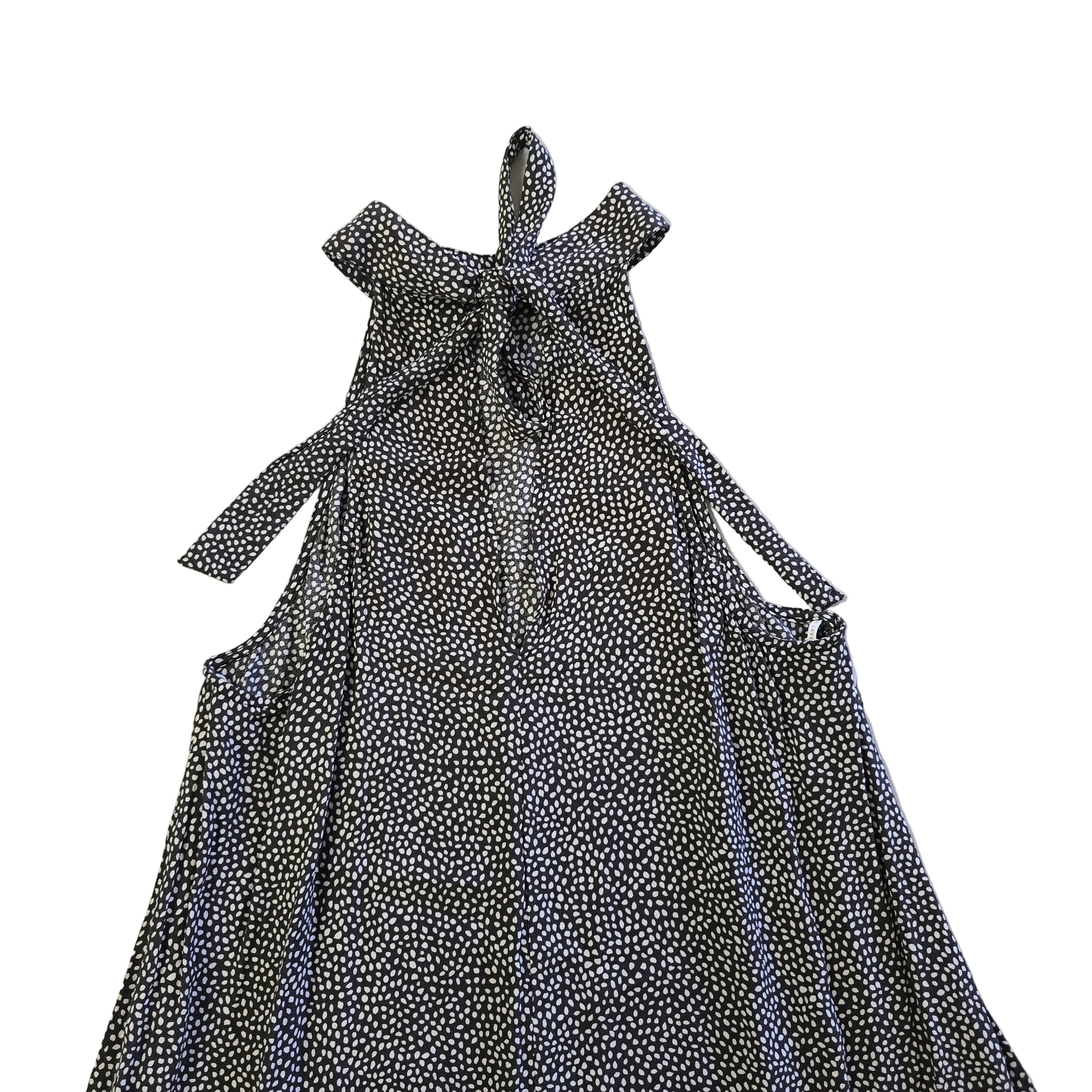 Black and white patterned dress on a tiled floor