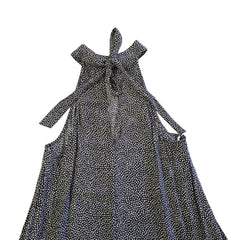 Black and white patterned dress on a tiled floor