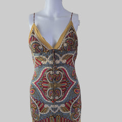 Mannequin wearing a patterned garment with a plain background