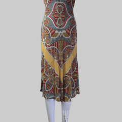 Colorful patterned dress on a white surface