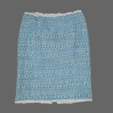Blue textured skirt on a tiled floor